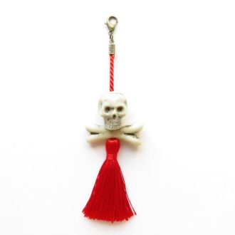 bijou de sac tête de mort pompon rouge